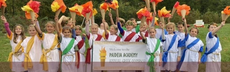 classical school students holding Greek Olympics